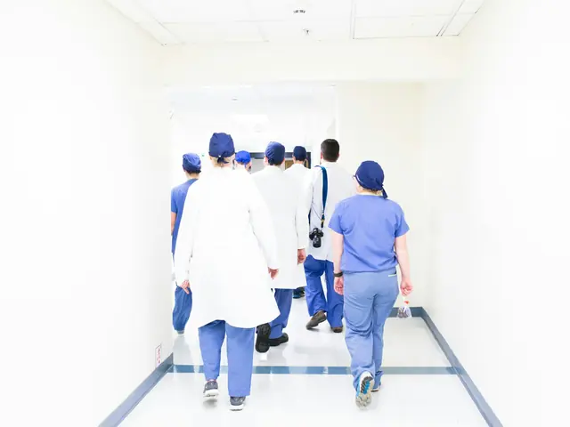 A care team walking down a bright hospital corridor